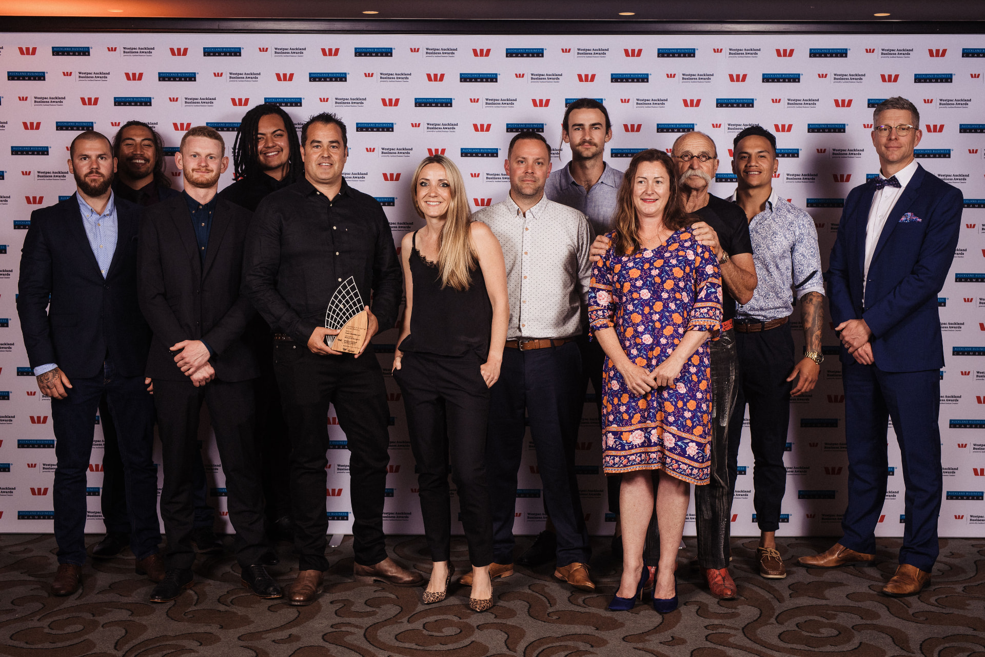 The Earth Stability team holding the award in front of the Westpac Auckland Business Awards backdrop