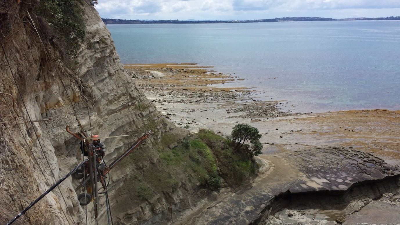 Rope access drilling on the coastal cliff face at Cliff Road, Torbay